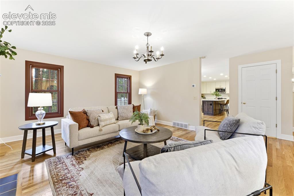 Image 8 of 50: Open and inviting with access to the kitchen!