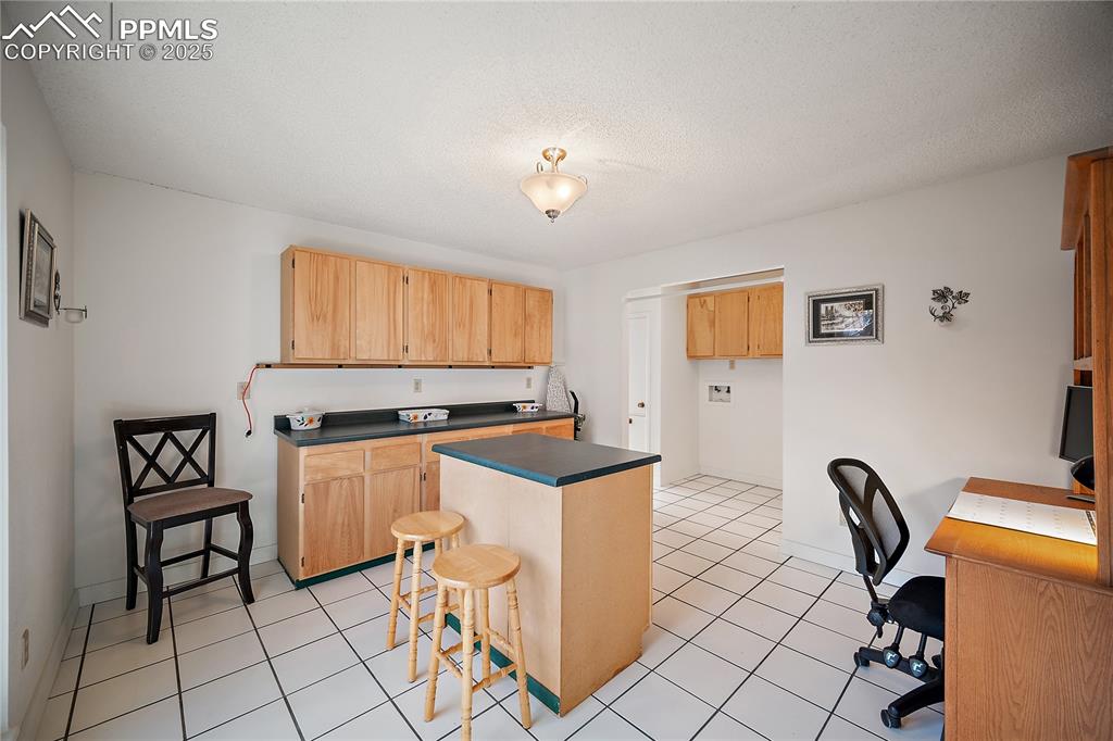Image 18 of 49: (NOT a KITCHEN) Just off the family room is a huge mud room. This space boa