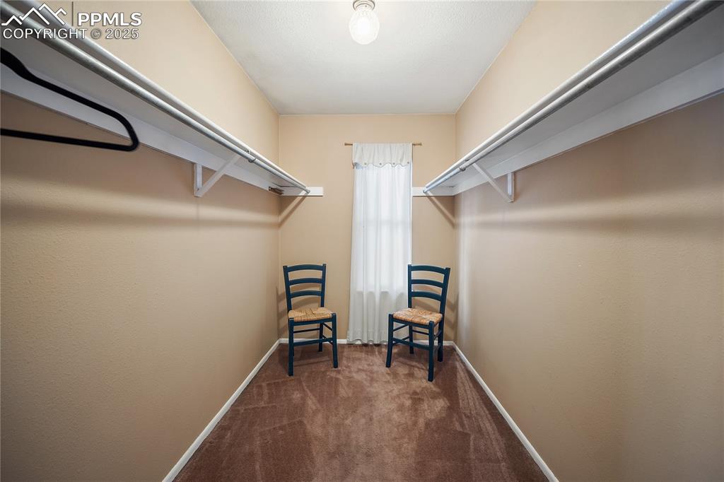 Image 26 of 49: Walk in closet with window. 