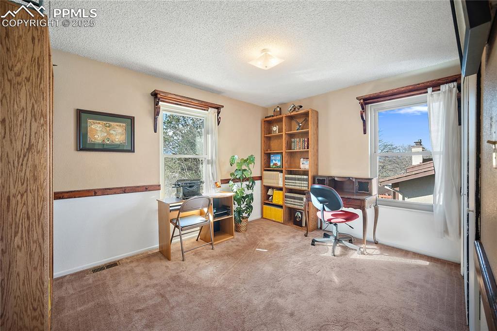 Image 31 of 49: Upstairs bedroom 4, Currently being used as an office. 