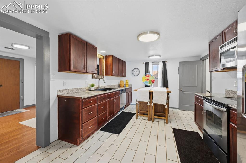 Image 13 of 48: The tile floor is an easy clean with children, pets or just active adults. 