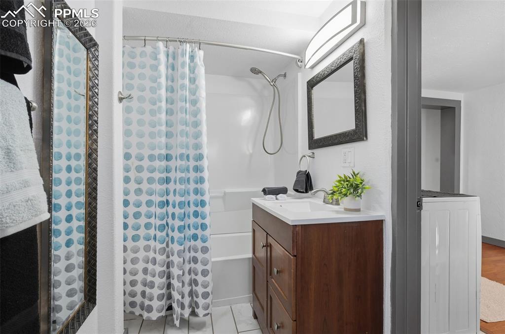 Image 20 of 48: New paint, new LED lighting finish off this full bathroom. 