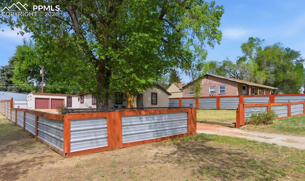 Image 45 of 48: There are beautiful mature trees and shrubs.