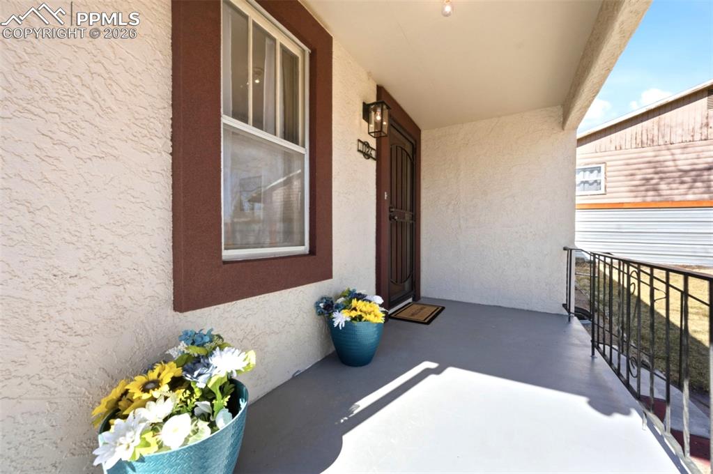 Image 5 of 48: New stucco pop-outs give the windows and doors a little more depth and beau