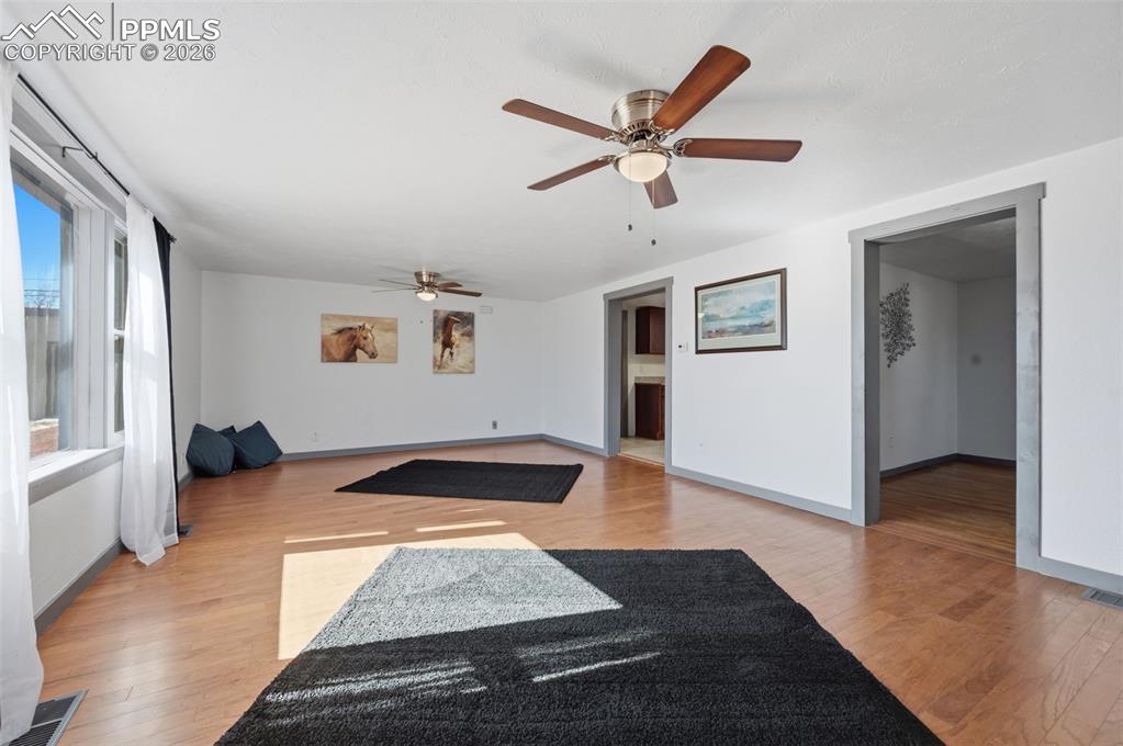 Image 8 of 48: Recently painted, with new trim, new lights and fans, and flooring.