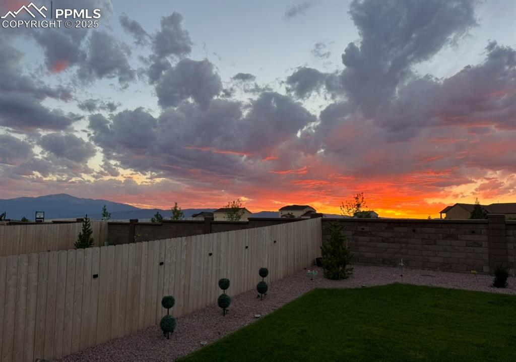 Image 2 of 37: View at sunset from back yard
