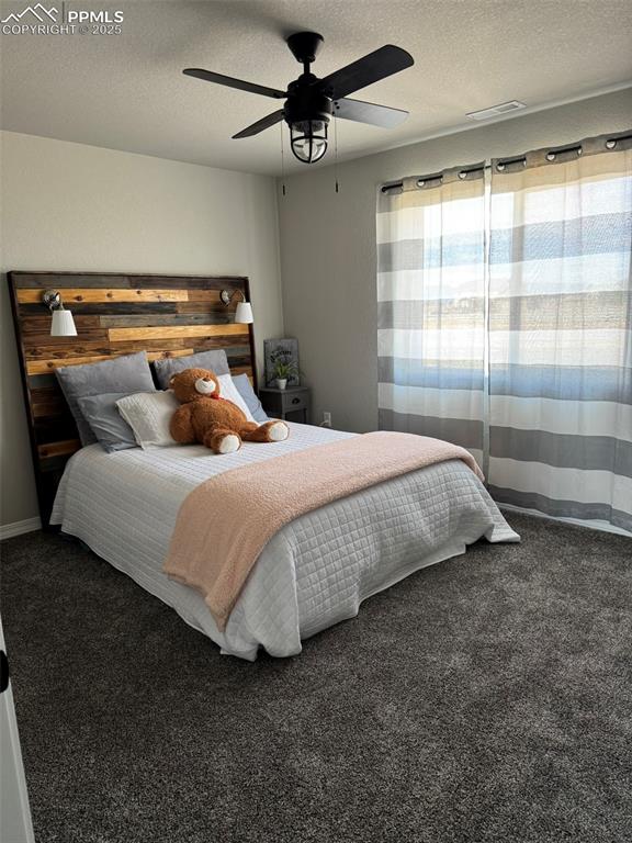 Image 24 of 37: Upper-level bedroom w walk-in closet
