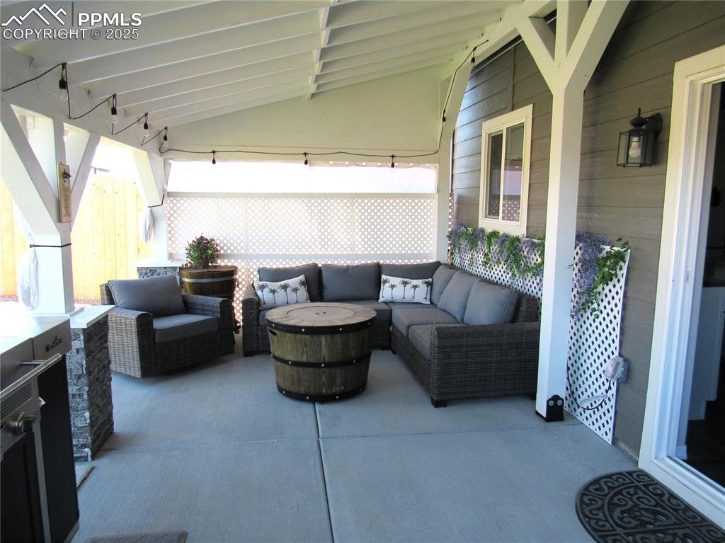 Image 29 of 37: Covered rear patio