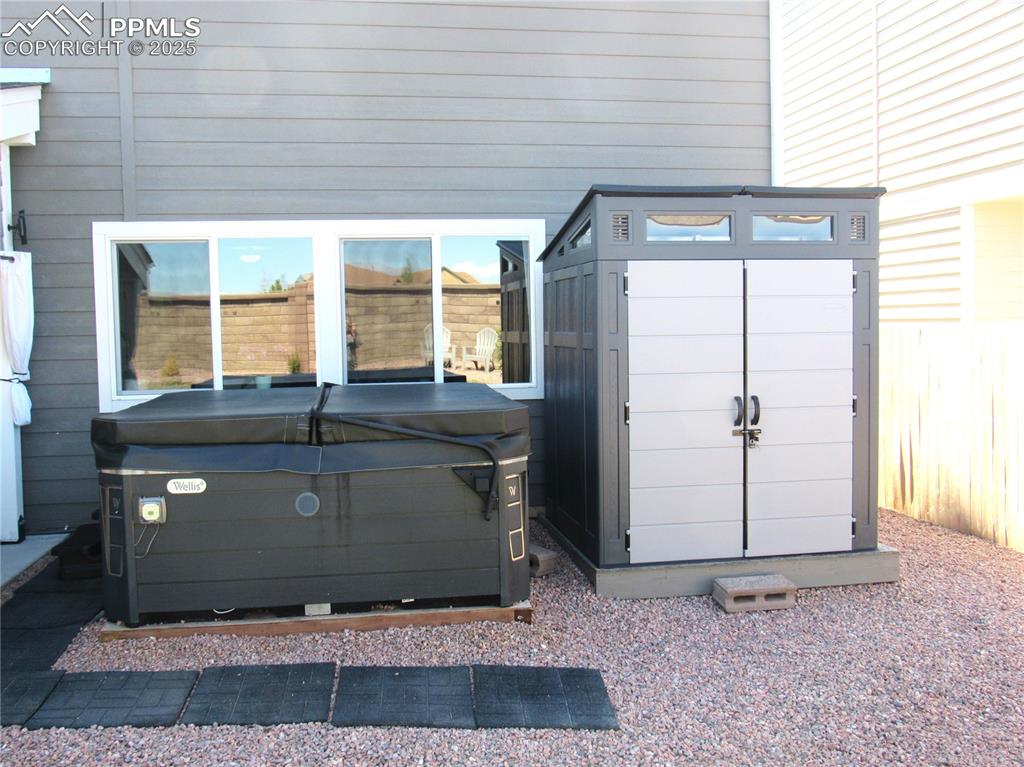 Image 33 of 37: Hot tub and storage shed