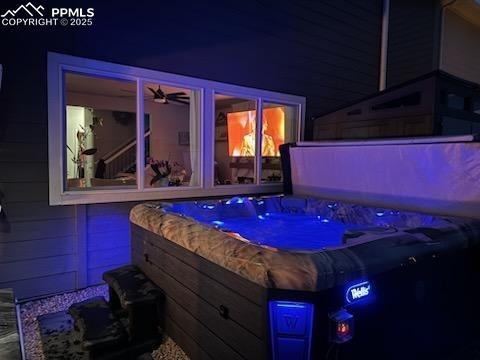 Image 35 of 37: Night-time view of hot tub