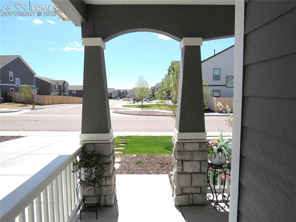 Image 37 of 37: Covered front patio as you walk out the front door