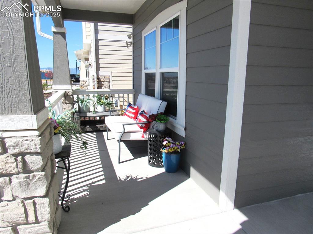 Image 7 of 37: Covered front patio