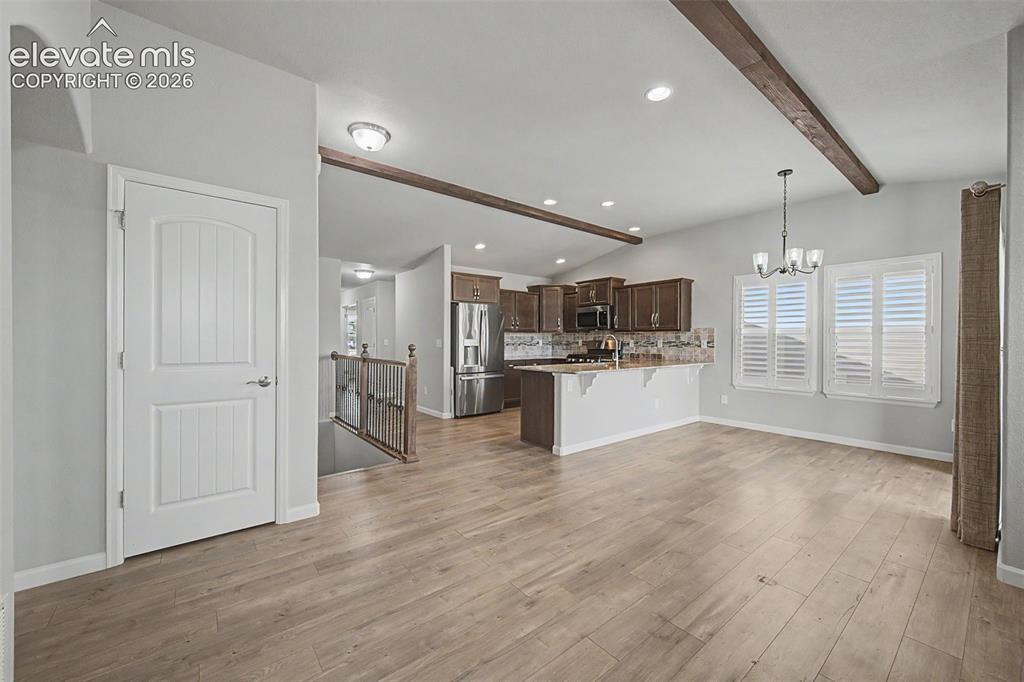 Image 8 of 28: Entertaining is a breeze with an open floorplan and easy access to the cove