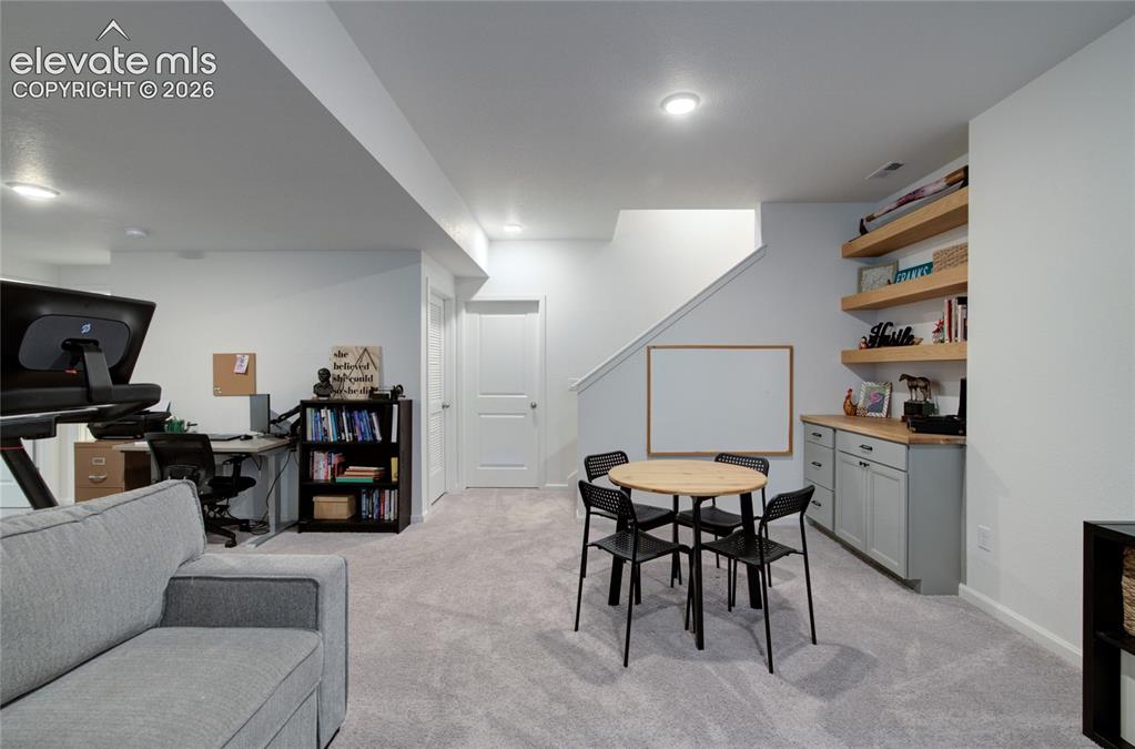Image 30 of 35: Spacious recreational area featuring light gray carpeting, recessed lightin