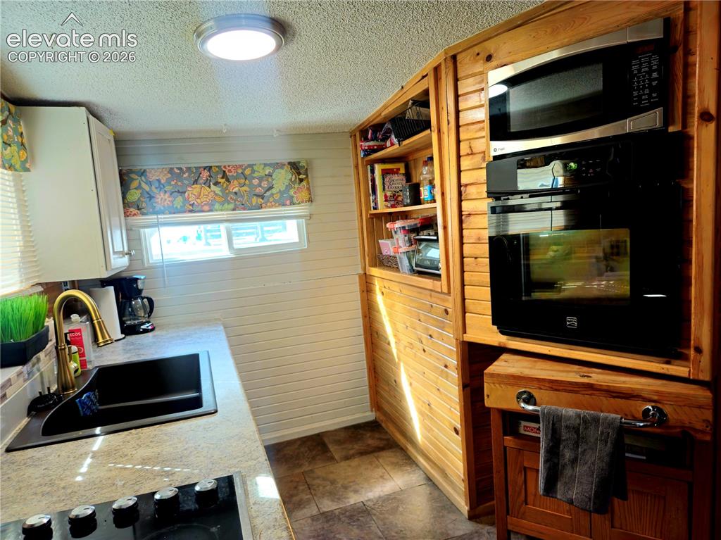 Image 15 of 37: Main house built in storage shelves