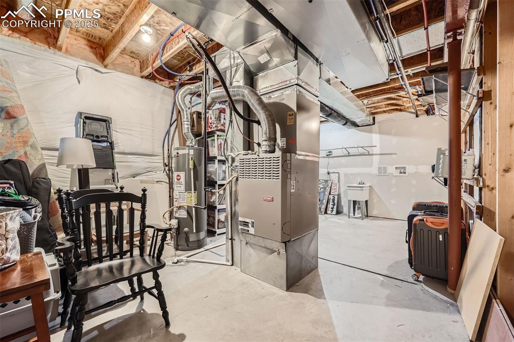 Image 23 of 49: Unfinished basement storage/utility space with 2nd washer/dryer hook up & u