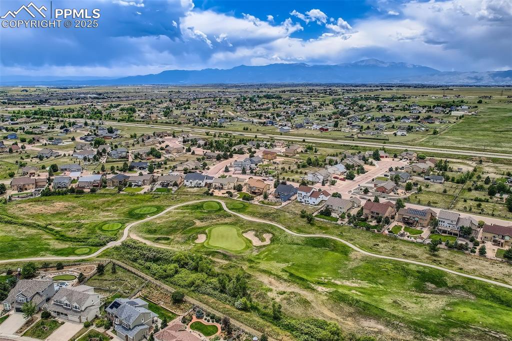 Image 34 of 49: View of property location featuring nearby suburban area and a mountain bac