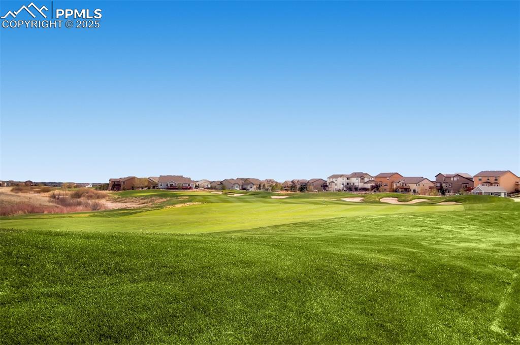 Image 48 of 49: Surrounding community featuring golf course and open space