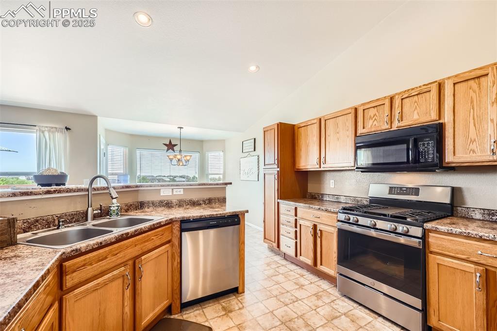 Image 8 of 49: Kitchen featuring stainless steel appliances, healthy amount of natural lig