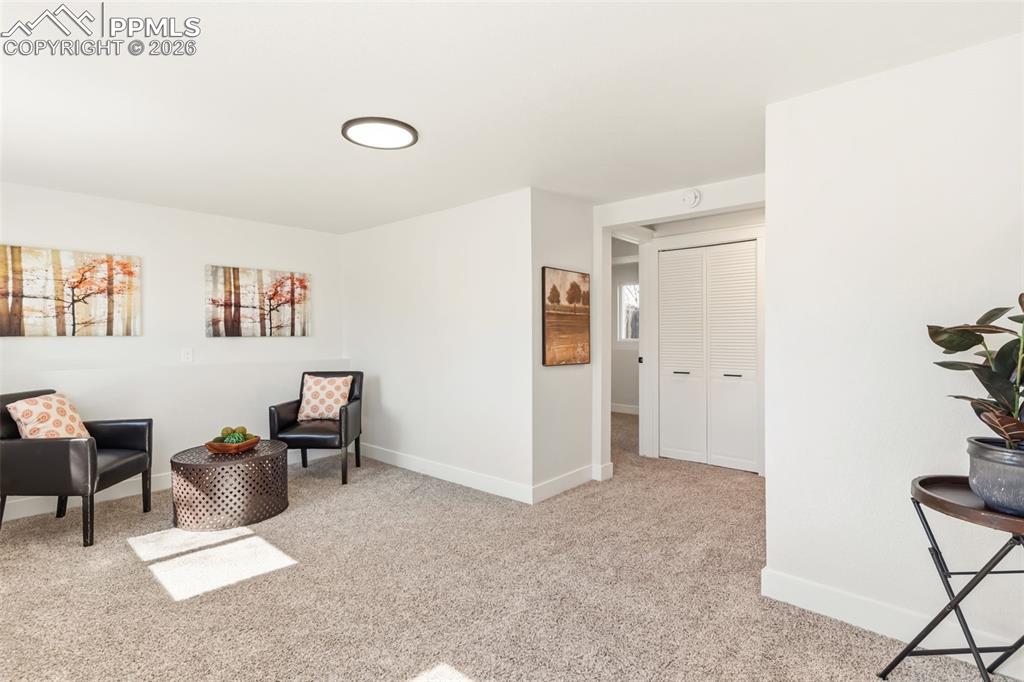 Image 27 of 37: Lower-level living area ideal for entertaining or relaxing