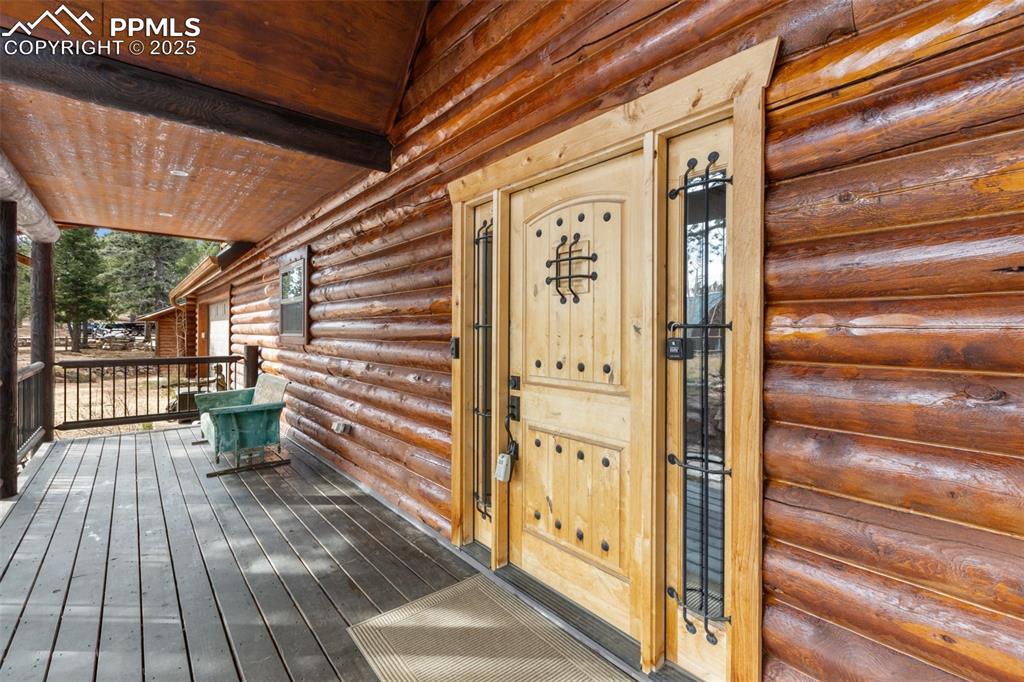 Image 2 of 46: Doorway to property with a deck