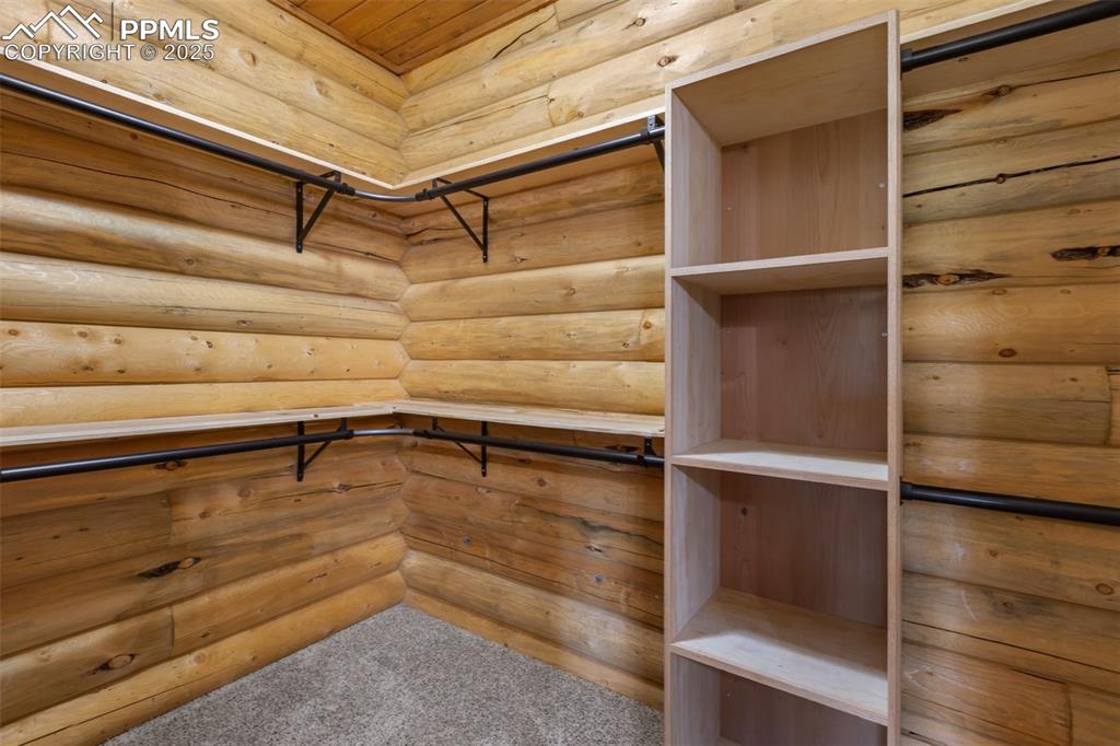 Image 32 of 46: Walk in closet featuring carpet flooring