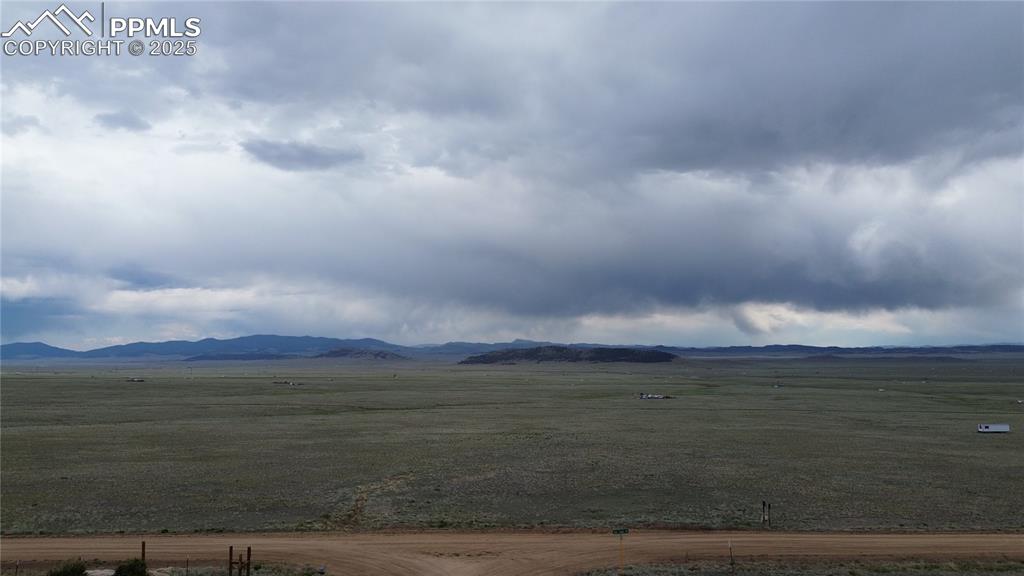 Image 6 of 8: View of mountain backdrop with rural landscape