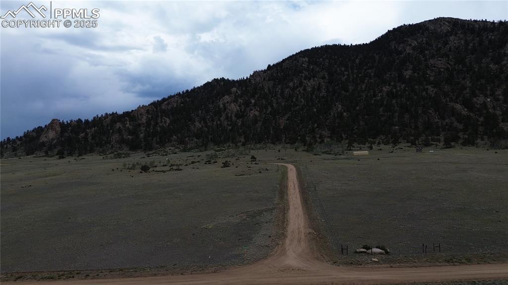 Image 8 of 8: View of mountain background with rural landscape and a forest