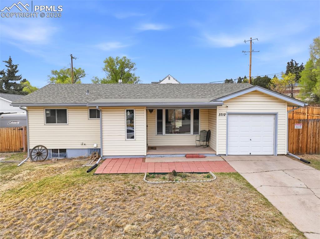 Image 1 of 47: View of front of house with a garage, roof with shingles, driveway, and cov