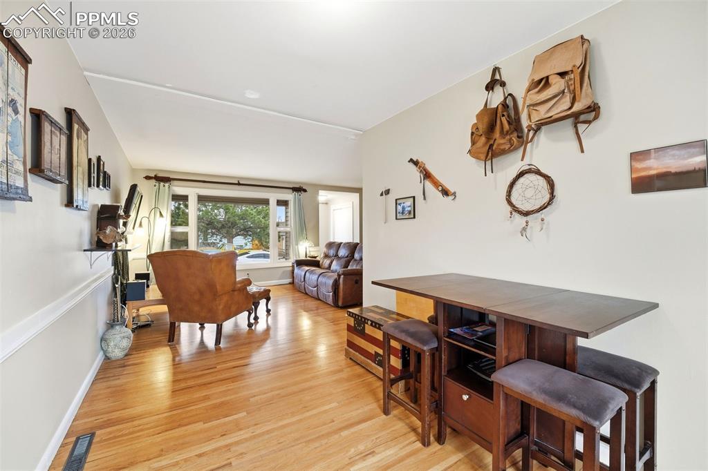 Image 14 of 47: Dining area featuring light wood-style flooring and baseboards