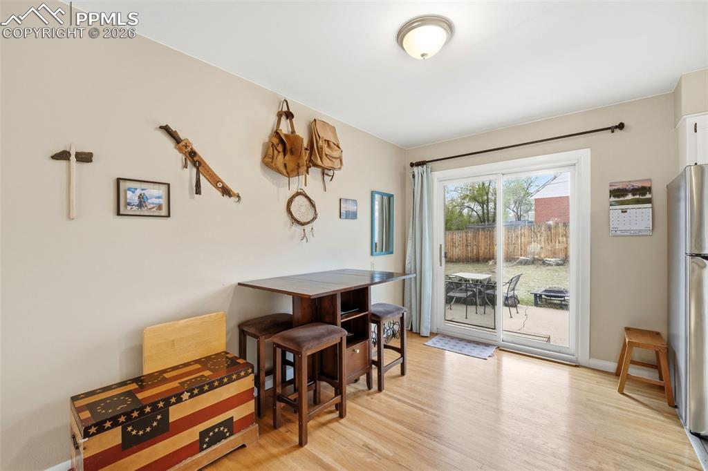 Image 15 of 47: Dining room featuring light wood-type flooring and baseboards