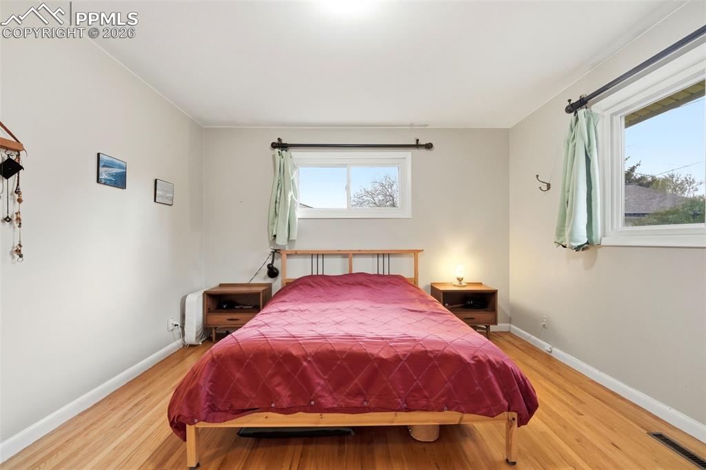 Image 17 of 47: Bedroom featuring light wood-type flooring and baseboards