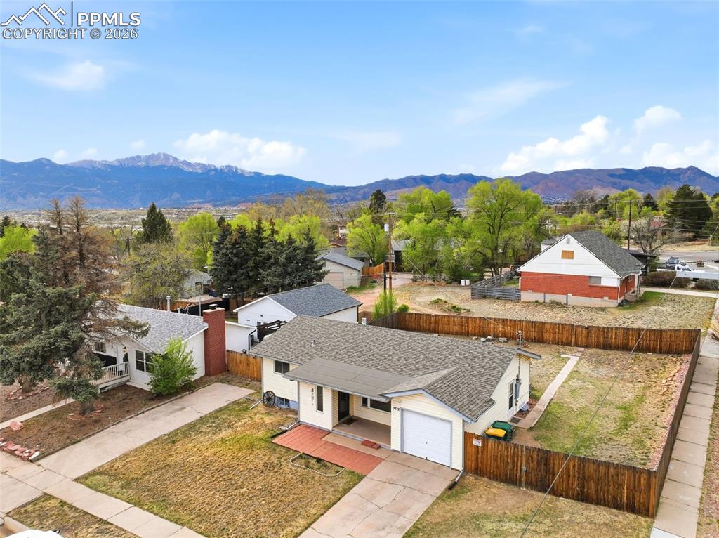 Image 2 of 47: Aerial view of residential area with mountains