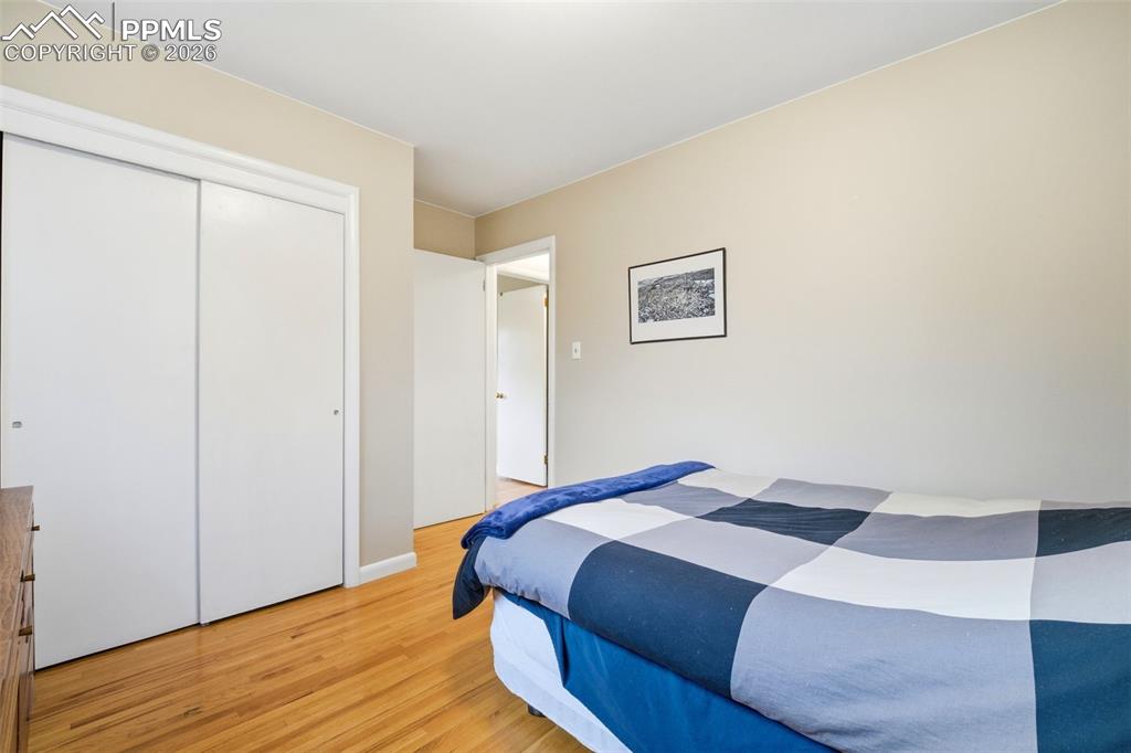 Image 22 of 47: Bedroom featuring light wood finished floors and a closet