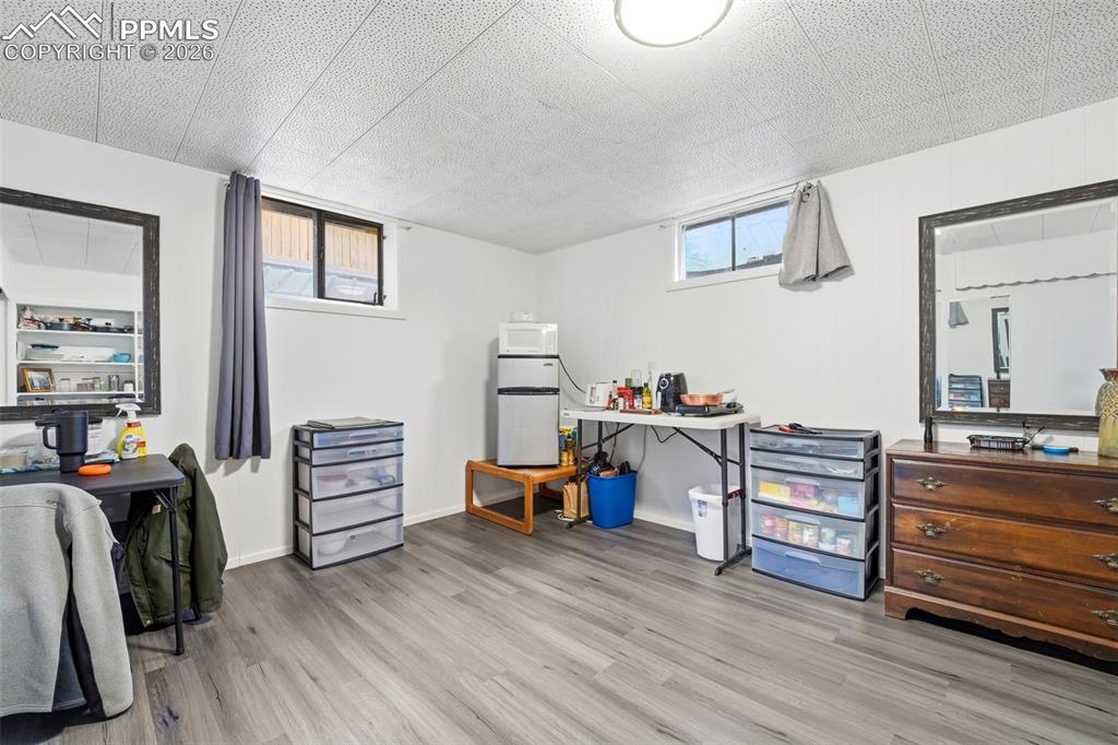 Image 30 of 47: Home office featuring light wood-style flooring and baseboards