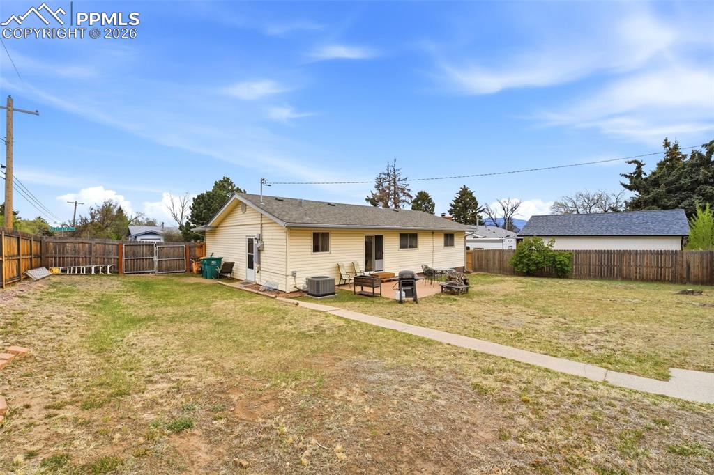 Image 35 of 47: Back of house with a patio area and a fenced backyard
