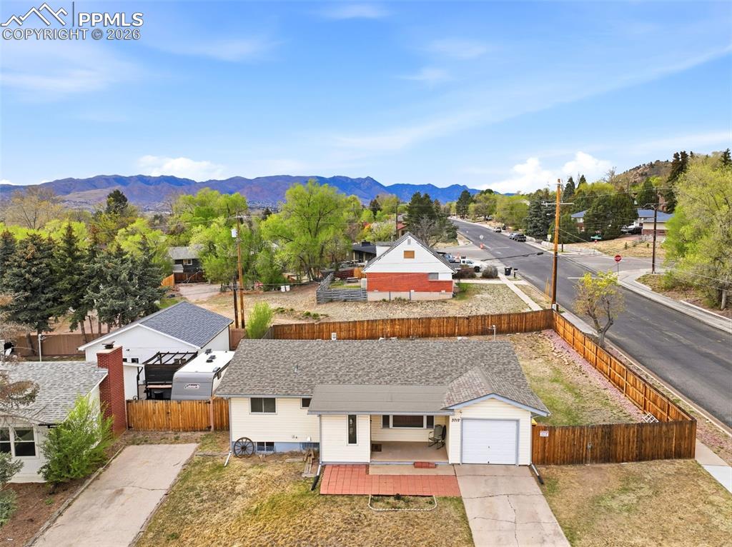 Image 44 of 47: Aerial view of property and surrounding area featuring mountains