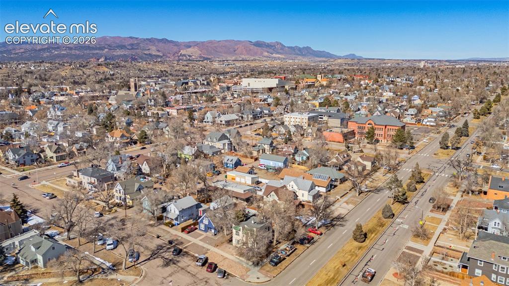 Image 32 of 33: Drone / aerial view featuring a residential view and a mountain view
