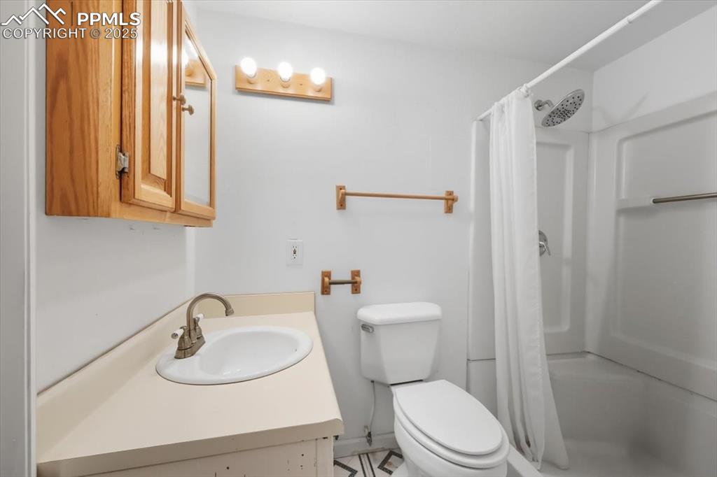 Image 9 of 23: Bathroom with vanity and a shower stall