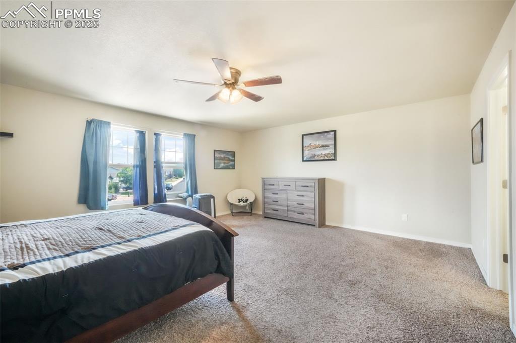 Image 23 of 48: Bedroom featuring carpet flooring and ceiling fan