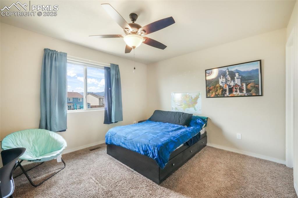 Image 34 of 48: Bedroom featuring carpet floors and a ceiling fan