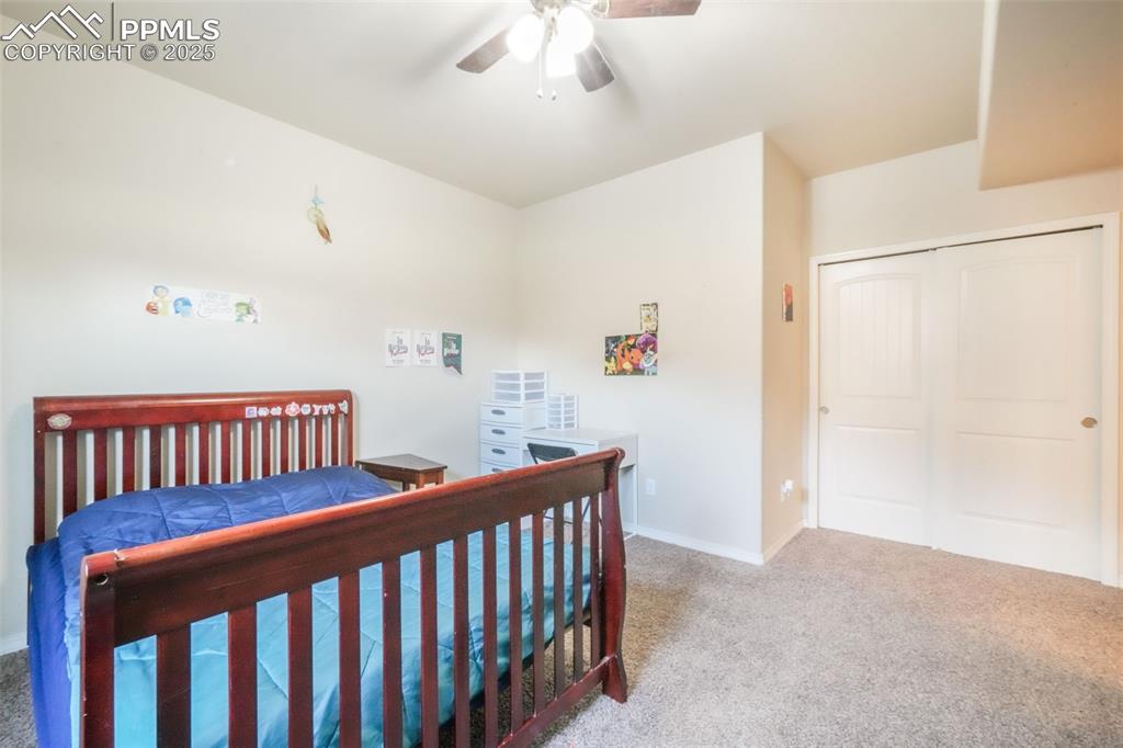 Image 42 of 48: Bedroom featuring carpet floors, a closet, and ceiling fan
