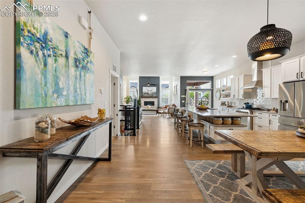 Image 23 of 49: Dining space with hardwood / wood-style flooring, recessed lighting, and a