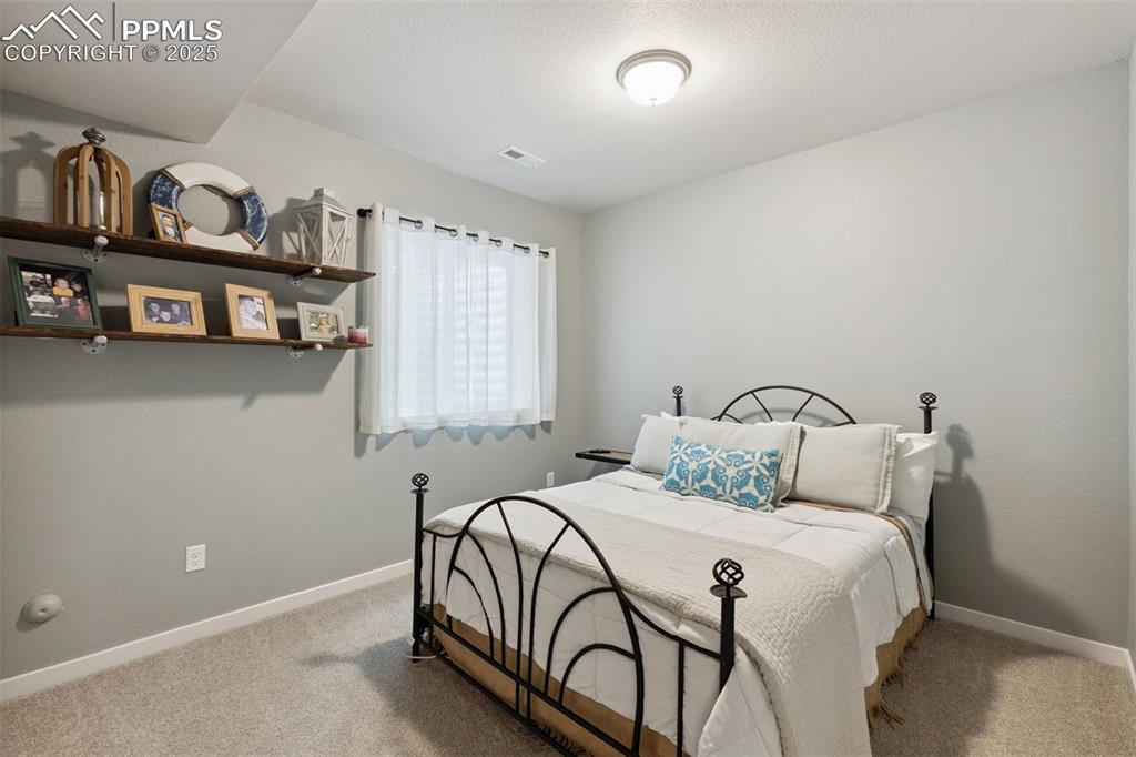Image 32 of 49: Bedroom featuring carpet floors and baseboards