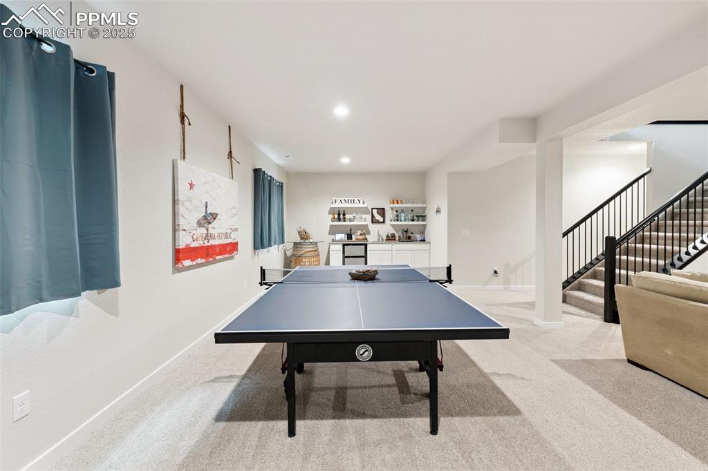Image 39 of 49: Playroom featuring light carpet and recessed lighting