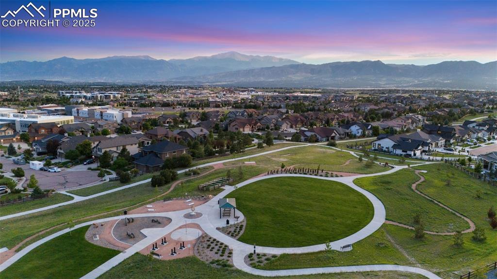 Image 49 of 49: Aerial view at dusk of a mountain view and a residential view