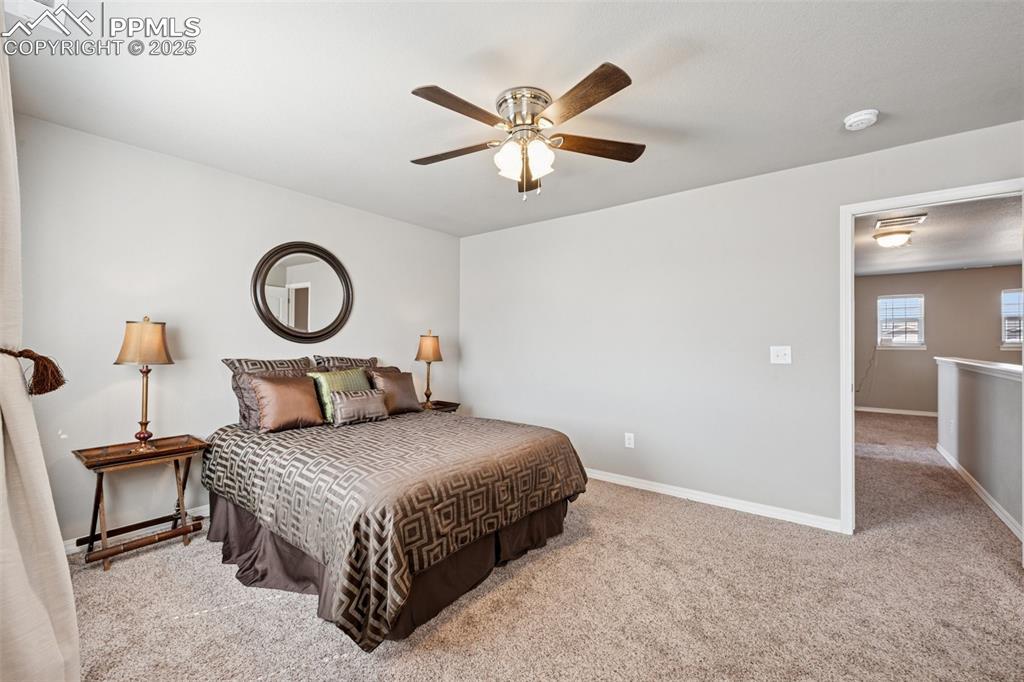 Image 15 of 39: Bedroom featuring light carpet and ceiling fan