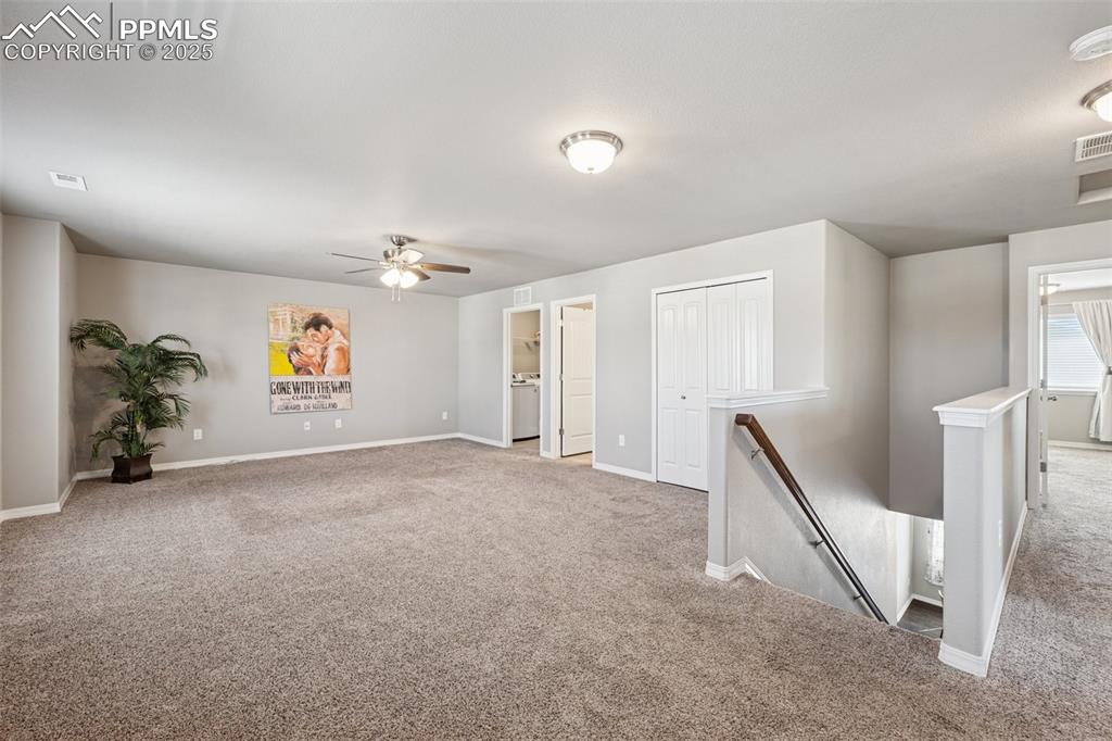 Image 22 of 39: Carpeted spare room featuring baseboards