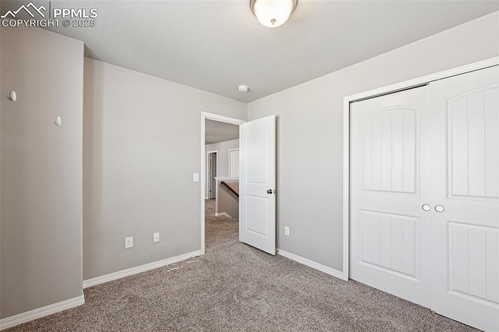 Image 26 of 39: Unfurnished bedroom featuring carpet floors and a closet