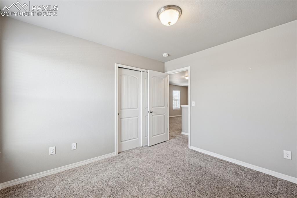 Image 28 of 39: Unfurnished bedroom featuring carpet flooring and a closet